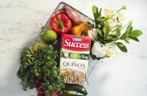 Basket filled with vegetables, flowers and Success® Quinoa Boil-in-Bag Package